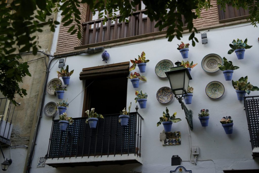 A building with a bunch of plates on the side of it